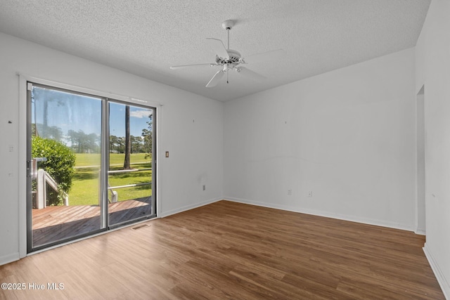 304 Lord Granville Dr, Morehead City, NC 28557 - spare room featuring wood finished floors, a textured ceiling, ceiling fan, and baseboards