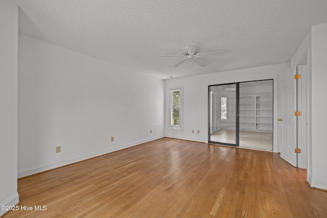 304 Lord Granville Dr, Morehead City, NC 28557 - spare room with a textured ceiling, light wood-style flooring, ceiling fan, and baseboards