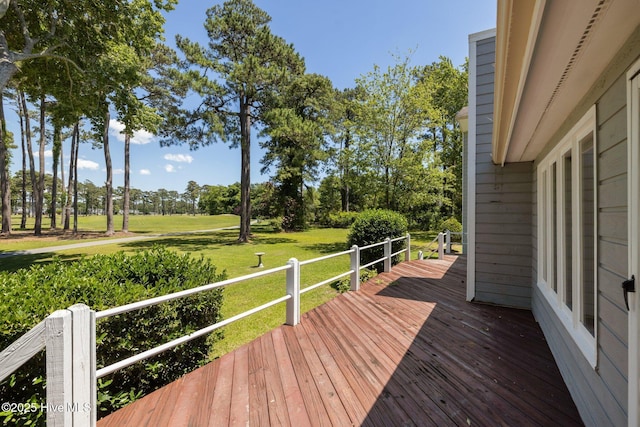 304 Lord Granville Dr, Morehead City, NC 28557 - wooden terrace featuring a yard and view of wooded area