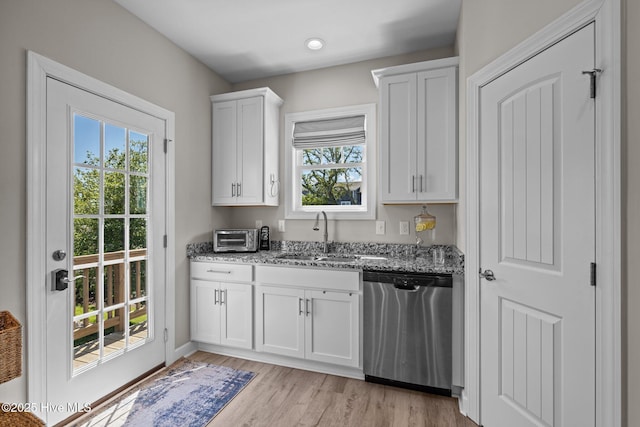 104 S 30th St, Morehead City, NC 28557 - kitchen with stainless steel dishwasher, a sink, light stone countertops, healthy amount of natural light, and recessed lighting