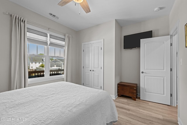 104 S 30th St, Morehead City, NC 28557 - bedroom featuring light wood finished floors, baseboards, a ceiling fan, and a closet