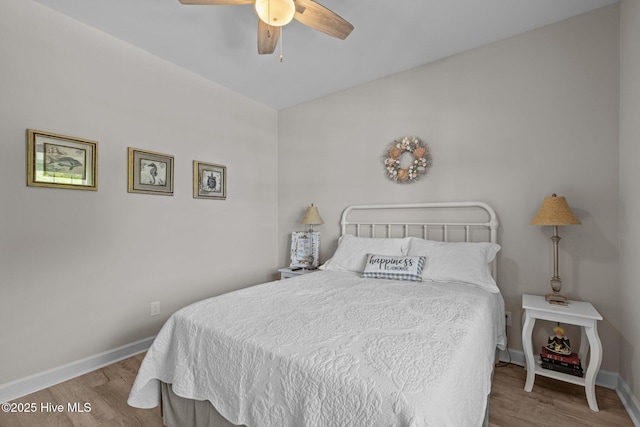 104 S 30th St, Morehead City, NC 28557 - bedroom featuring wood finished floors, baseboards, and a ceiling fan