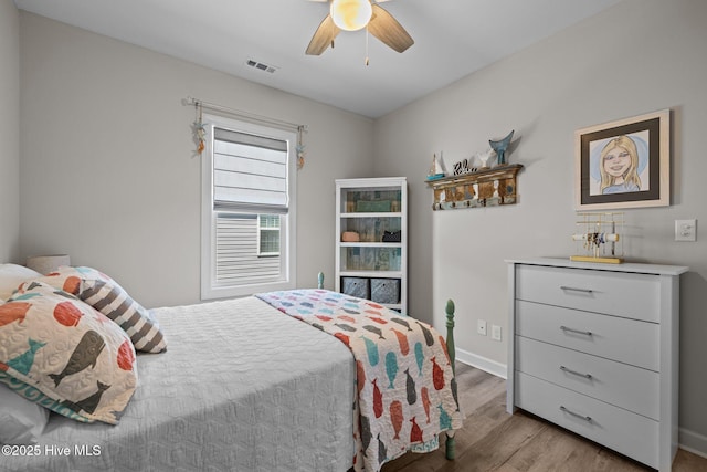 104 S 30th St, Morehead City, NC 28557 - bedroom featuring wood finished floors, a ceiling fan, and baseboards