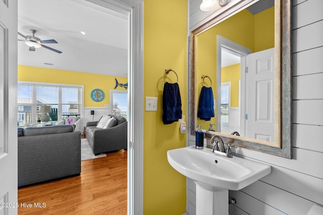 2414 Ocean Dr, Emerald Isle, NC 28594 - bathroom featuring ceiling fan, wood finished floors, and a sink