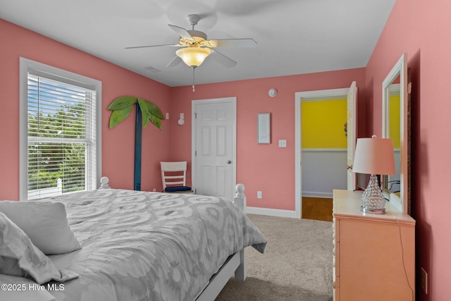 2414 Ocean Dr, Emerald Isle, NC 28594 - carpeted bedroom with baseboards and ceiling fan