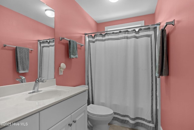 2414 Ocean Dr, Emerald Isle, NC 28594 - full bathroom featuring vanity, toilet, and curtained shower