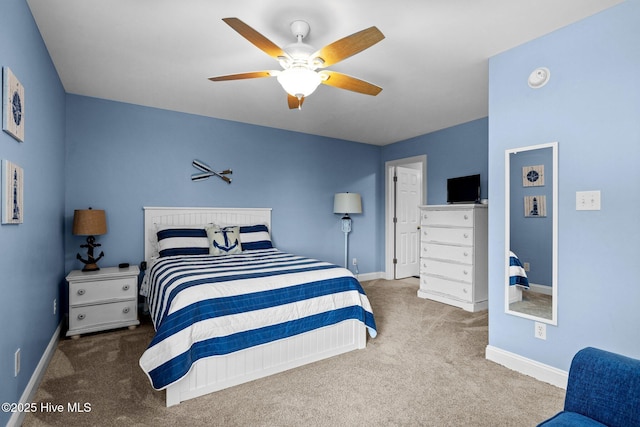 2414 Ocean Dr, Emerald Isle, NC 28594 - carpeted bedroom featuring baseboards and a ceiling fan