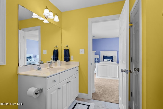 2414 Ocean Dr, Emerald Isle, NC 28594 - bathroom featuring vanity, ensuite bath, tile patterned floors, and baseboards