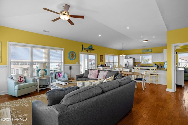 2414 Ocean Dr, Emerald Isle, NC 28594 - living area with lofted ceiling, wainscoting, wood finished floors, ceiling fan, and recessed lighting