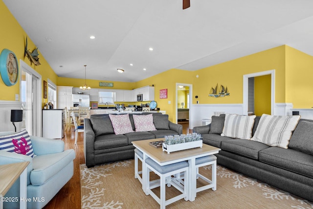 2414 Ocean Dr, Emerald Isle, NC 28594 - living area featuring a chandelier, light wood finished floors, recessed lighting, and wainscoting