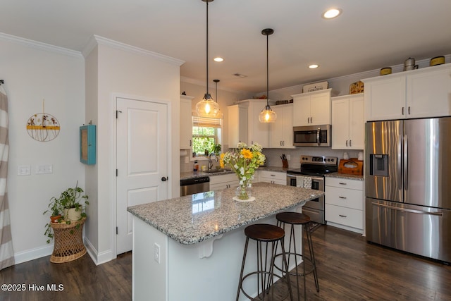 111 Pinelands Vis, Jackson Springs, NC 27281 - kitchen featuring stainless steel appliances, a sink, dark wood finished floors, white cabinetry, and backsplash