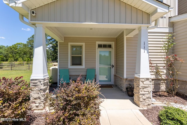 111 Pinelands Vis, Jackson Springs, NC 27281 - view of exterior entry featuring board and batten siding and stone siding