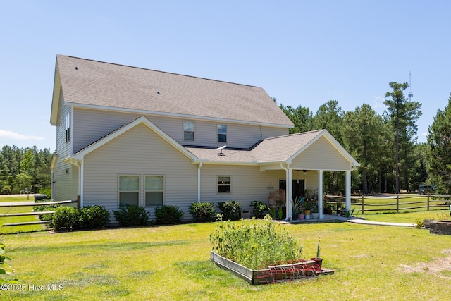 111 Pinelands Vis, Jackson Springs, NC 27281 - rear view of property featuring a garden and a shingled roof