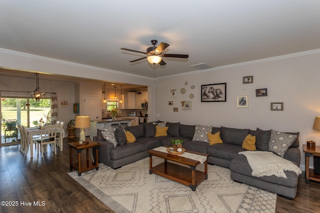 111 Pinelands Vis, Jackson Springs, NC 27281 - living area featuring wood finished floors, ornamental molding, and ceiling fan