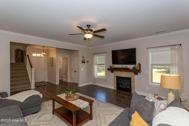 111 Pinelands Vis, Jackson Springs, NC 27281 - living area featuring stairway, ceiling fan, crown molding, wood finished floors, and a glass covered fireplace