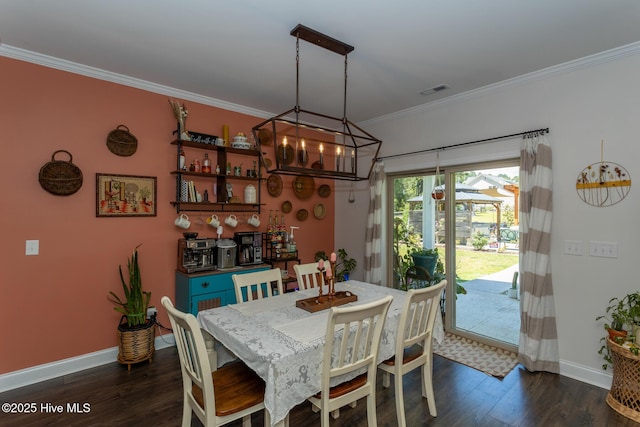 111 Pinelands Vis, Jackson Springs, NC 27281 - dining room featuring ornamental molding, baseboards, a chandelier, and dark wood-type flooring