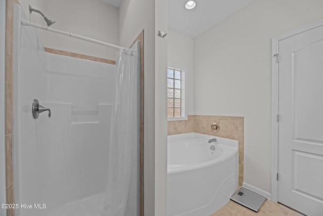 3412 Lefringhouse Ln, New Bern, NC 28562 - full bath with a stall shower, a garden tub, tile patterned floors, and baseboards