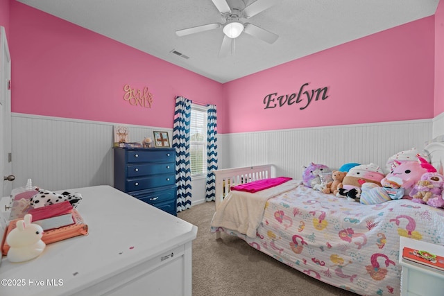 3412 Lefringhouse Ln, New Bern, NC 28562 - carpeted bedroom featuring wainscoting and a ceiling fan