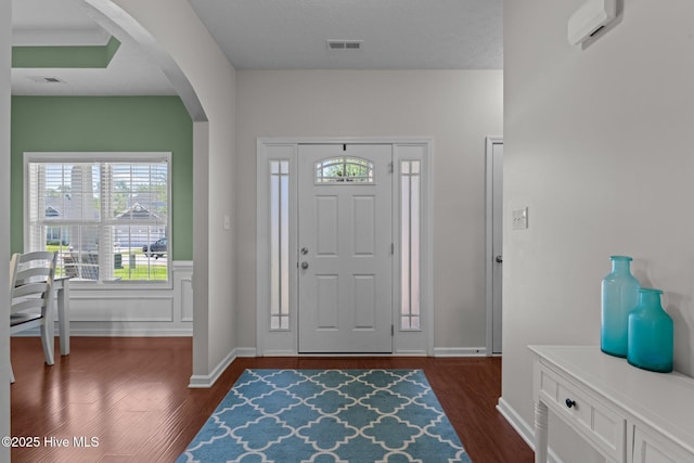 3412 Lefringhouse Ln, New Bern, NC 28562 - foyer entrance featuring dark wood-style flooring, arched walkways, and baseboards