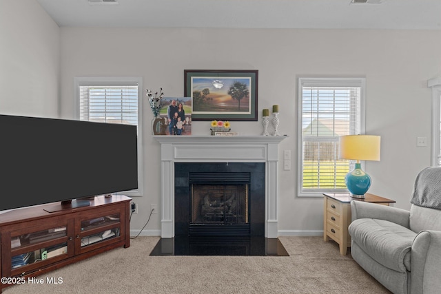 3412 Lefringhouse Ln, New Bern, NC 28562 - living area featuring carpet flooring, baseboards, and a fireplace with flush hearth