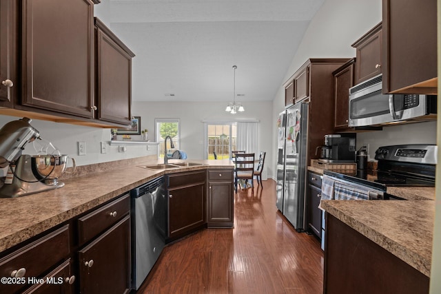 3412 Lefringhouse Ln, New Bern, NC 28562 - kitchen with stainless steel appliances, a sink, lofted ceiling, dark brown cabinets, and dark wood-style flooring