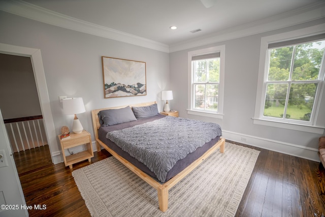 1309 N Pasteur St, New Bern, NC 28560 - bedroom with dark wood finished floors, crown molding, and recessed lighting