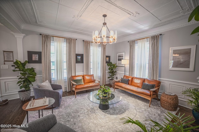 1309 N Pasteur St, New Bern, NC 28560 - living area featuring wood finished floors, a decorative wall, crown molding, a chandelier, and a wainscoted wall