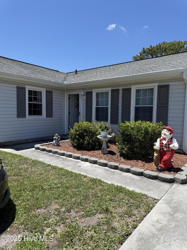 1164 Hibbs Rd, Newport, NC 28570 - ranch-style home featuring a front yard and roof with shingles