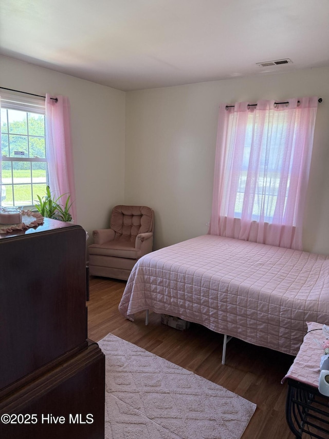 1164 Hibbs Rd, Newport, NC 28570 - bedroom with multiple windows and wood finished floors