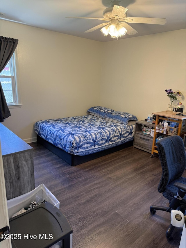 1164 Hibbs Rd, Newport, NC 28570 - bedroom featuring wood finished floors, a ceiling fan, and an office area