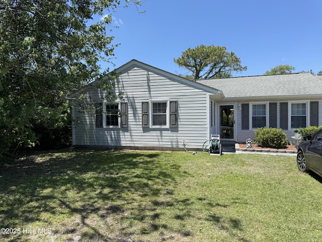1164 Hibbs Rd, Newport, NC 28570 - ranch-style house with a front lawn and roof with shingles