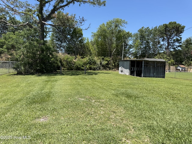 1164 Hibbs Rd, Newport, NC 28570 - view of yard with an outdoor structure, a pole building, and view of wooded area