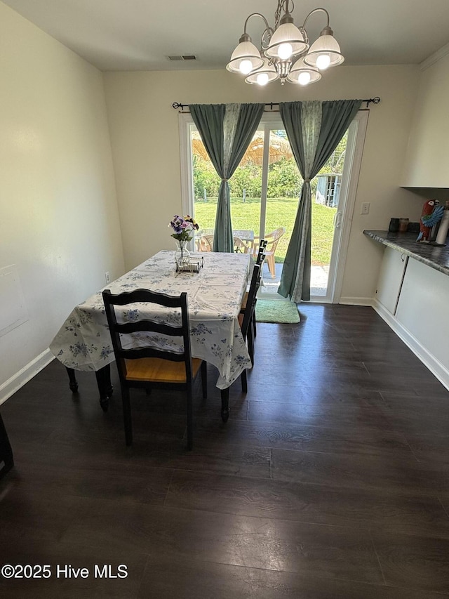 1164 Hibbs Rd, Newport, NC 28570 - dining space with a chandelier, baseboards, and healthy amount of natural light