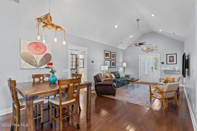 124 NE 35th St, Oak Island, NC 28465 - dining space with wood finished floors, high vaulted ceiling, baseboards, ceiling fan, and healthy amount of natural light