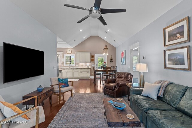 124 NE 35th St, Oak Island, NC 28465 - living area with lofted ceiling, a ceiling fan, wood finished floors, recessed lighting, and a chandelier