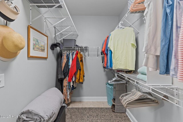 124 NE 35th St, Oak Island, NC 28465 - walk in closet with light tile patterned flooring