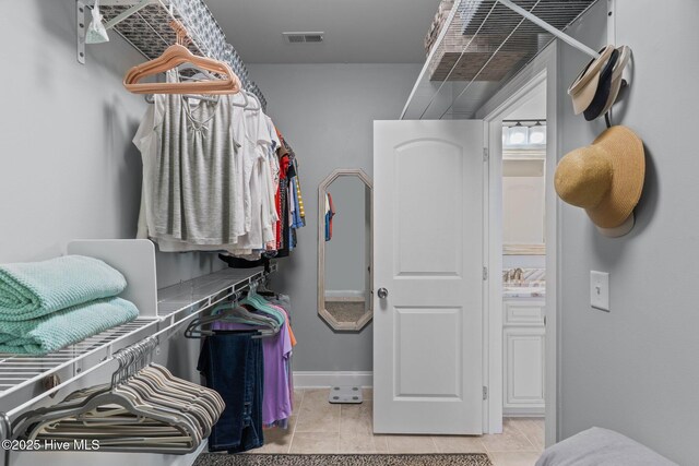 124 NE 35th St, Oak Island, NC 28465 - spacious closet featuring light tile patterned floors