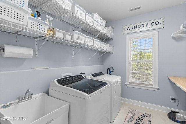124 NE 35th St, Oak Island, NC 28465 - washroom with separate washer and dryer and baseboards