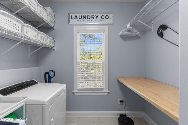 124 NE 35th St, Oak Island, NC 28465 - laundry area featuring marble look tile flooring, baseboards, and washing machine and dryer