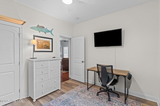 124 NE 35th St, Oak Island, NC 28465 - office space featuring ceiling fan, wood finished floors, and baseboards