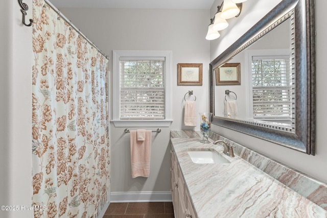 124 NE 35th St, Oak Island, NC 28465 - full bath with vanity, baseboards, tile patterned floors, and a shower with curtain