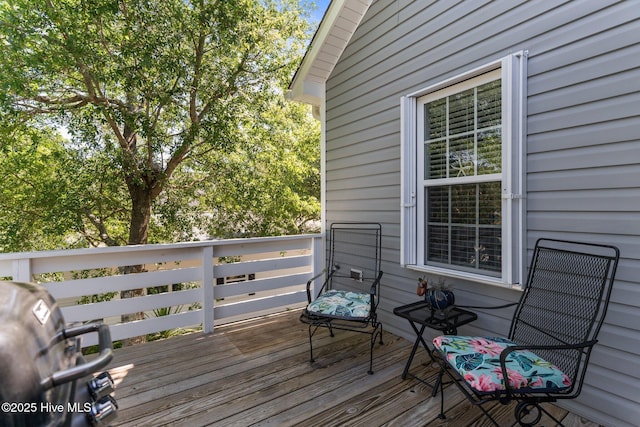 124 NE 35th St, Oak Island, NC 28465 - wooden terrace with area for grilling