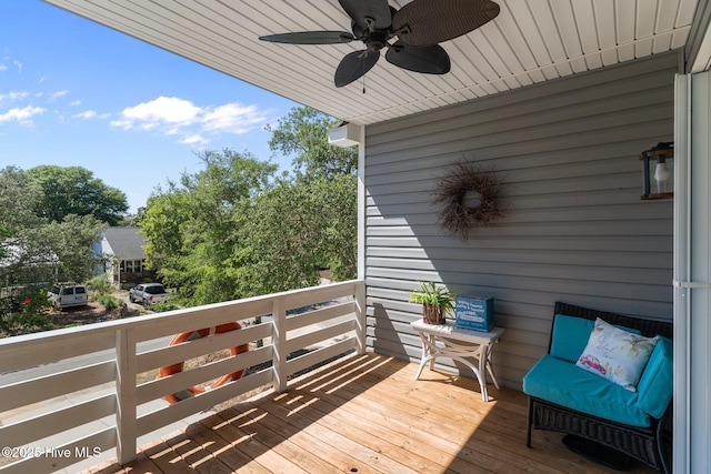 124 NE 35th St, Oak Island, NC 28465 - wooden terrace with a ceiling fan
