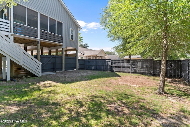 124 NE 35th St, Oak Island, NC 28465 - view of yard featuring a sunroom and stairway