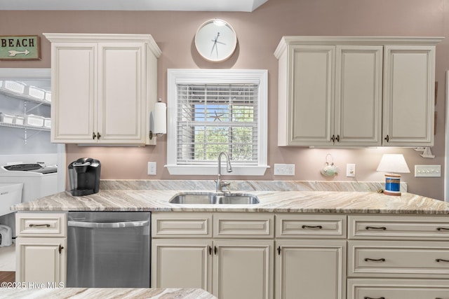 124 NE 35th St, Oak Island, NC 28465 - kitchen with dishwasher, a sink, washing machine and clothes dryer, and light stone counters