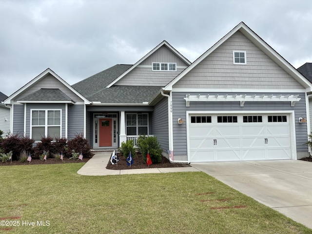 7000 Sevilleen Dr SW, Ocean Isle Beach, NC 28469 - craftsman inspired home with a front yard, an attached garage, driveway, and roof with shingles