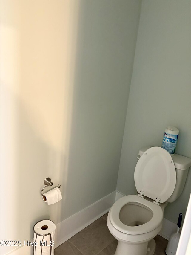 7000 Sevilleen Dr SW, Ocean Isle Beach, NC 28469 - bathroom with toilet, tile patterned flooring, and baseboards