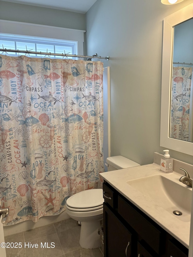 7000 Sevilleen Dr SW, Ocean Isle Beach, NC 28469 - full bath featuring tile patterned floors, vanity, toilet, and a shower with shower curtain
