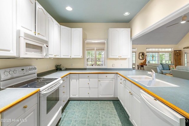 3193 Wexford Way, Southport, NC 28461 - kitchen with white appliances, a sink, white cabinetry, healthy amount of natural light, and recessed lighting