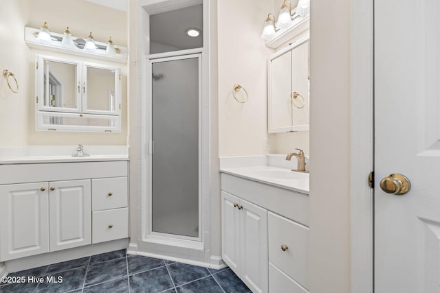 3193 Wexford Way, Southport, NC 28461 - bathroom featuring a shower stall, two vanities, and tile patterned flooring